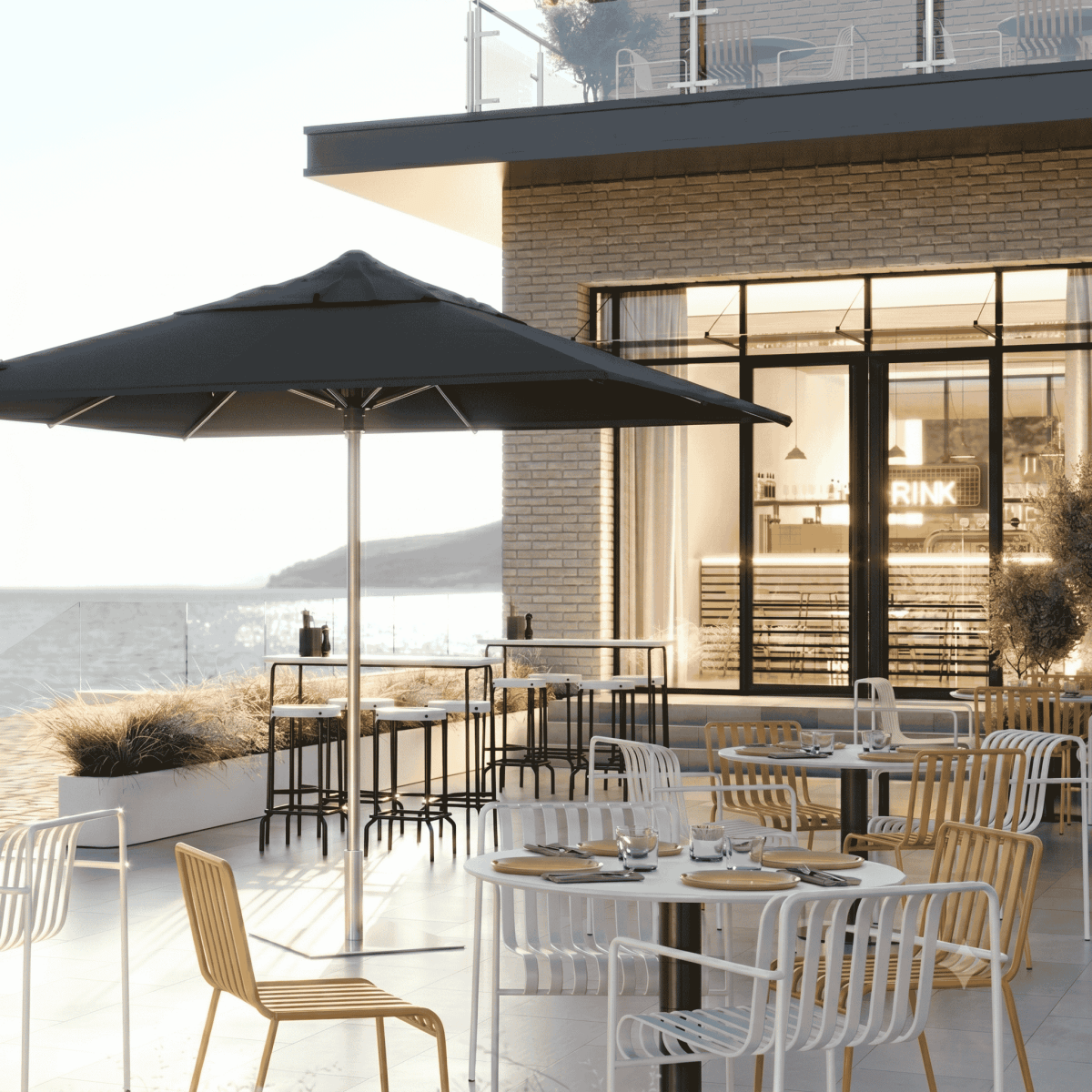 Shadowspec Oasis Cafe and Resort Center Pole umbrella with square canopy a restaurant terrace overlooking the ocean