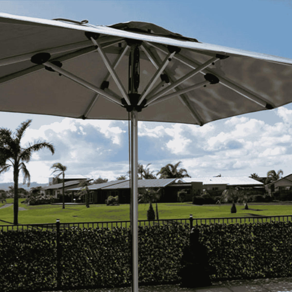Shadowspec Oasis Cafe and Resort Center Pole umbrella with square canopy in a residential garden