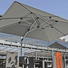 Shadowspec Tilting Offset umbrella on a restaurant terrace