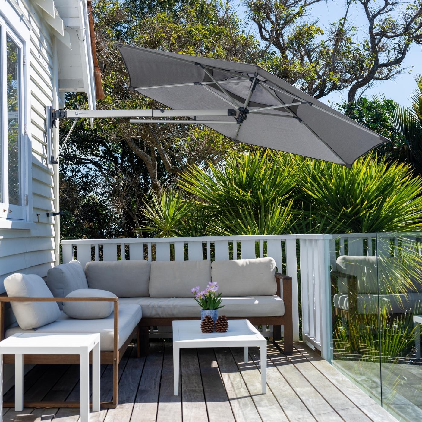 Shadowspec Retreat Wall-Mounted umbrella at a residential deck