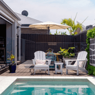 Shadowspec Retreat Wall Mounted umbrella at outdoor deck with pool