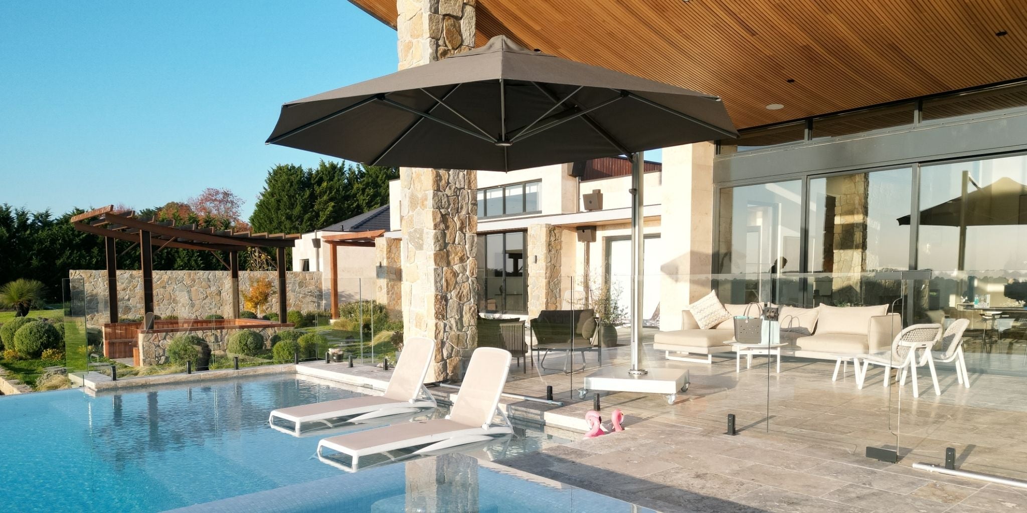 Shadowspec Serenity umbrella by a pool in a residential setting