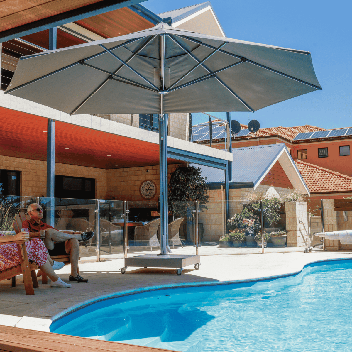 Shadowspec Serenity Rotating Cantilever umbrella with octagonal canopy at a residential pool side
