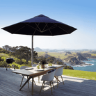Shadowspec Serenity Rotating Cantilever Umbrella with octagonal canopy at a residential patio overlooking the ocean
