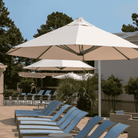 Shadowspec Serenity Rotating Cantilever umbrella with octagonal canopy at a resort pool side