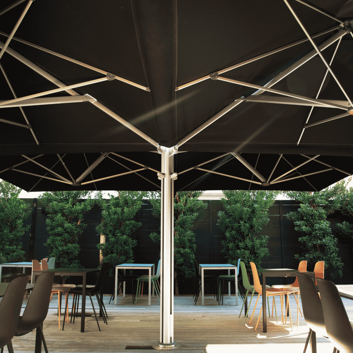 Shadowspec Unity Quattro Multi-Canopy Cantilever umbrella at a restaurant terrace