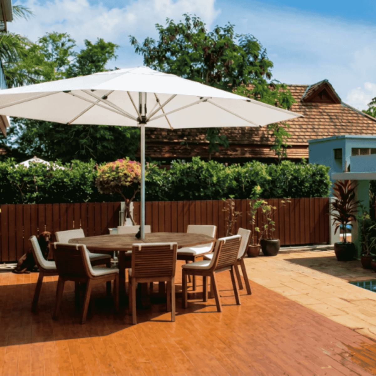 Shadowspec Oasis Cafe and Resort Center Pole umbrella with octagonal canopy at a residential outdoor dining set