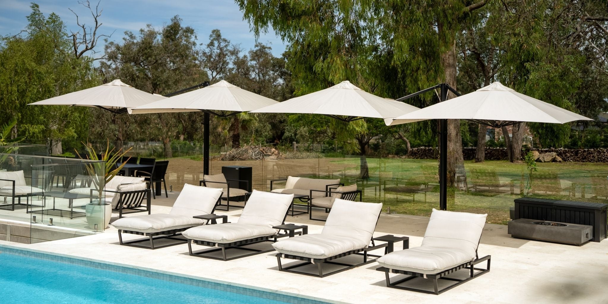 Shadowspec Unity Duo umbrellas by a poolside in a resort setting