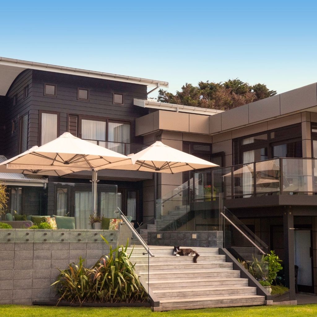 Shadowspec Unity Trio umbrella on an outdoor deck in residential setting