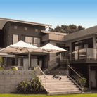 Shadowspec Unity Trio Multi-Canopy Cantilever umbrella at a residential outdoor setting